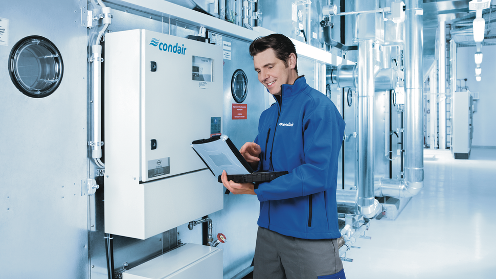 Technician configures a Condair humidity control system Technician configures a Condair humidity control system
